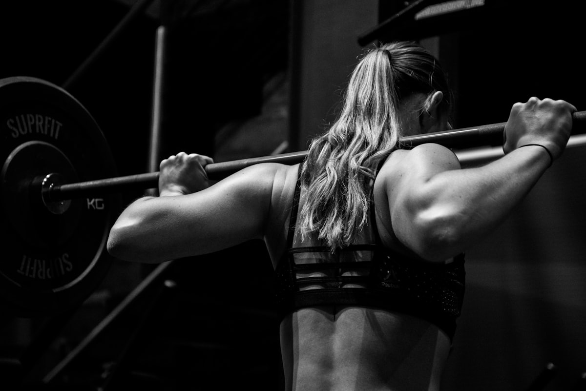 Athlete training, followed by her coach